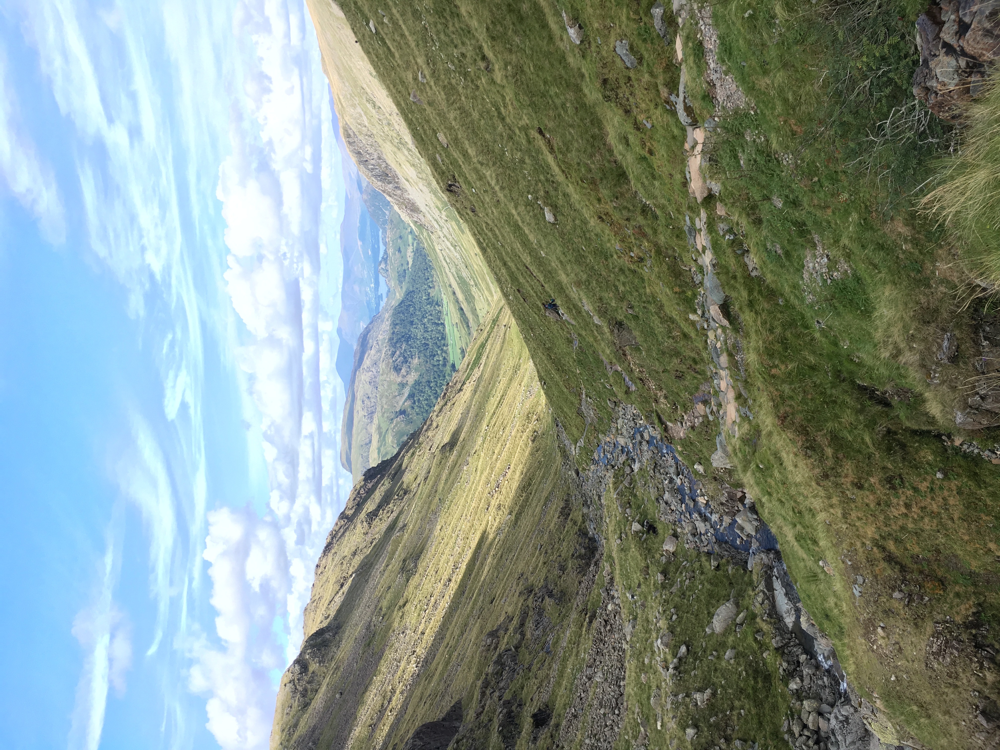 A quiet valley stream beneath open mountain skies